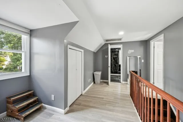 a view of a hallway with windows