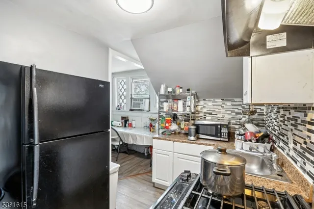 a kitchen with a sink and cabinets