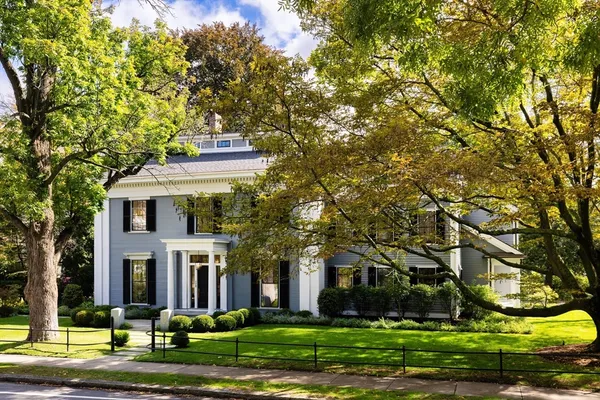 a front view of a house with a yard