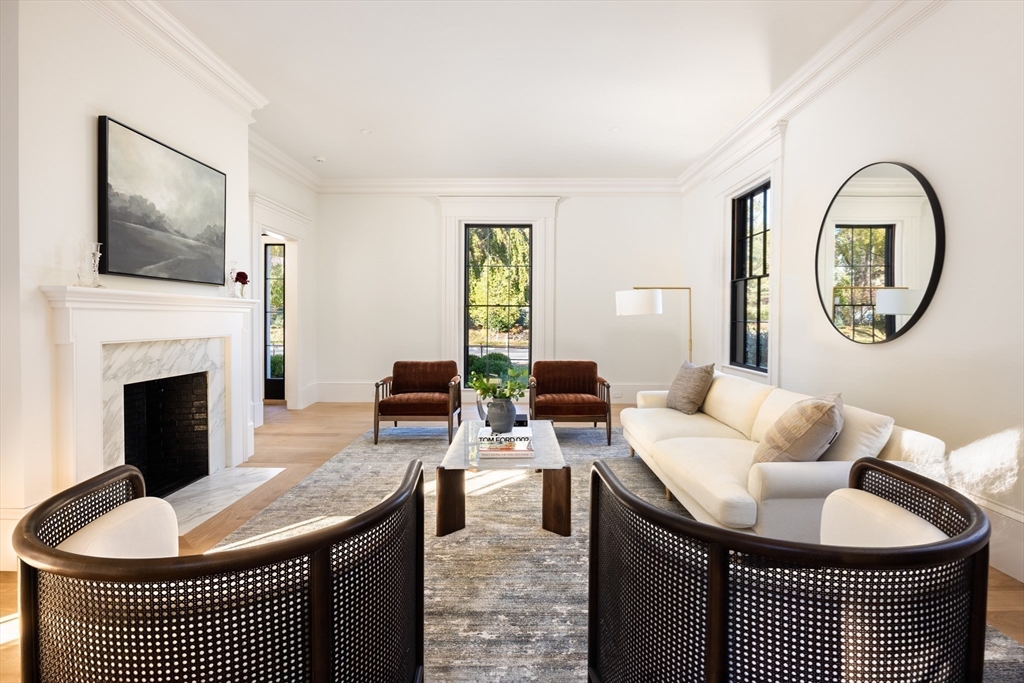 172 Brattle Street Cambridge, MA 02138 - Photo 13 of 42 a living room with furniture a flat screen tv and a fireplace