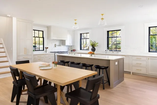 a view of a dining room with furniture and window