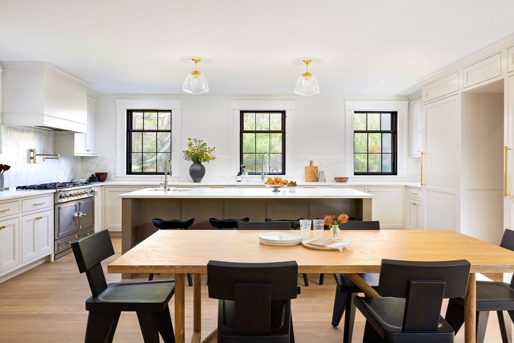 172 Brattle Street Cambridge, MA 02138 - Photo 6 of 42 a kitchen with a dining table chairs and window