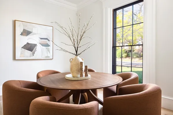 a dining room with furniture and window