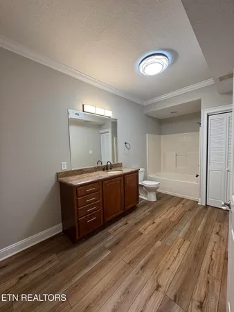 a living room with a dresser