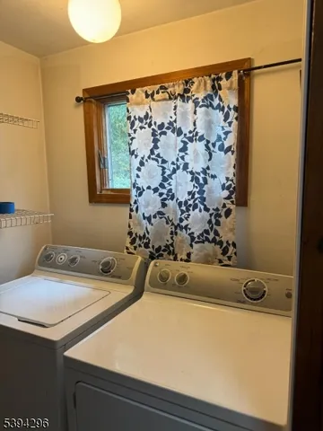 a bathroom with a sink and a shower curtain