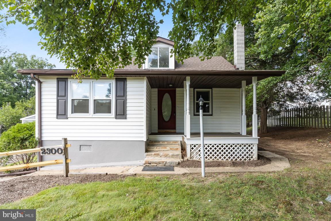 2300 Liberty Road Sykesville, MD 21784 - Photo 1 of 25 a front view of a house with a porch