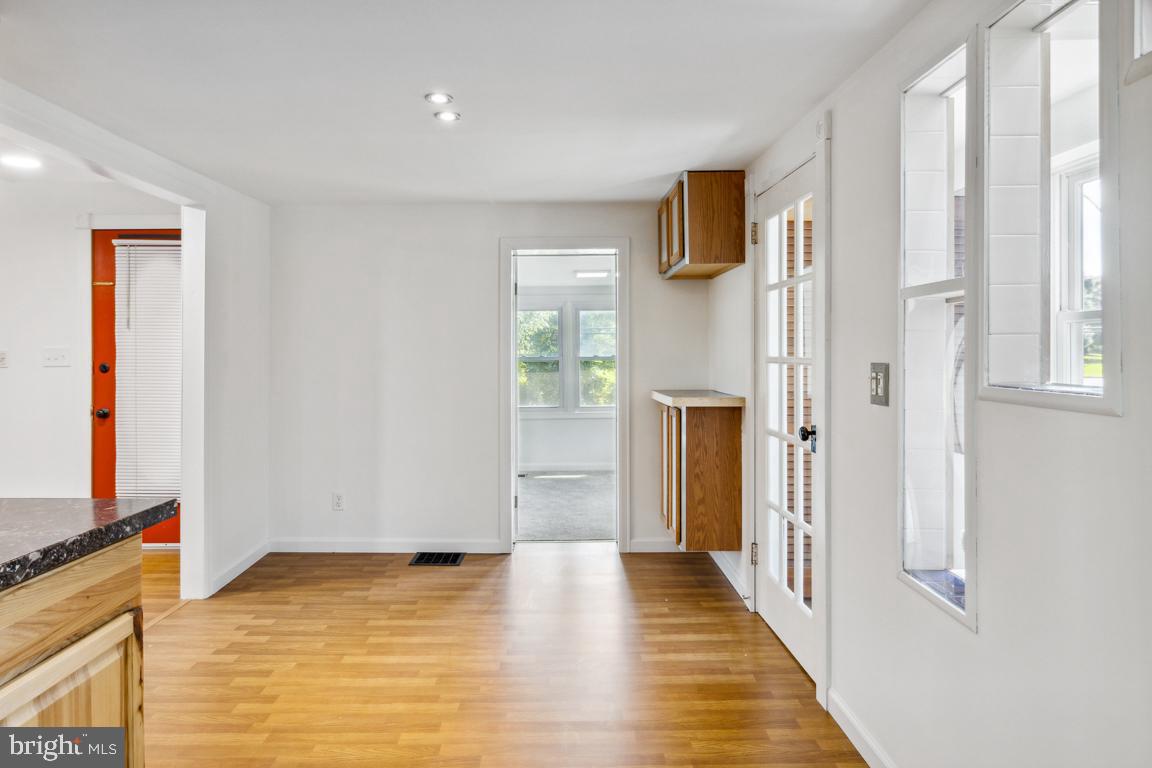 2300 Liberty Road Sykesville, MD 21784 - Photo 13 of 25 a view of a livingroom with wooden floor and a flat screen tv