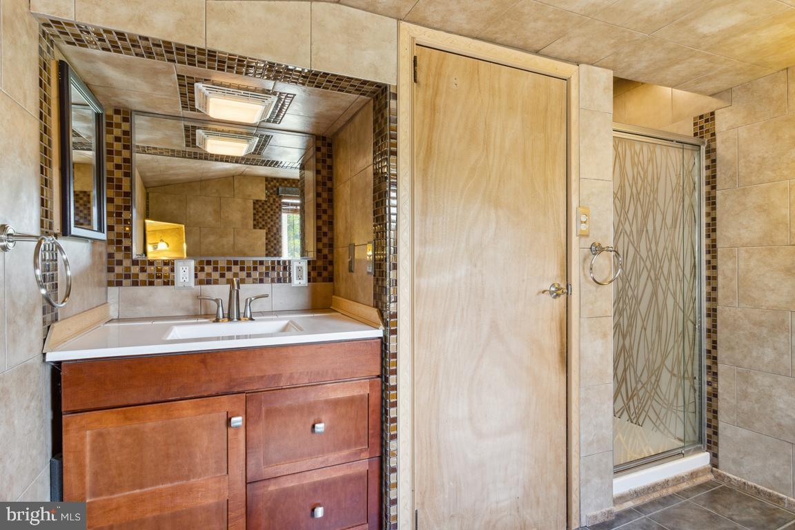 2300 Liberty Road Sykesville, MD 21784 - Photo 17 of 25 a bathroom with a sink and a mirror