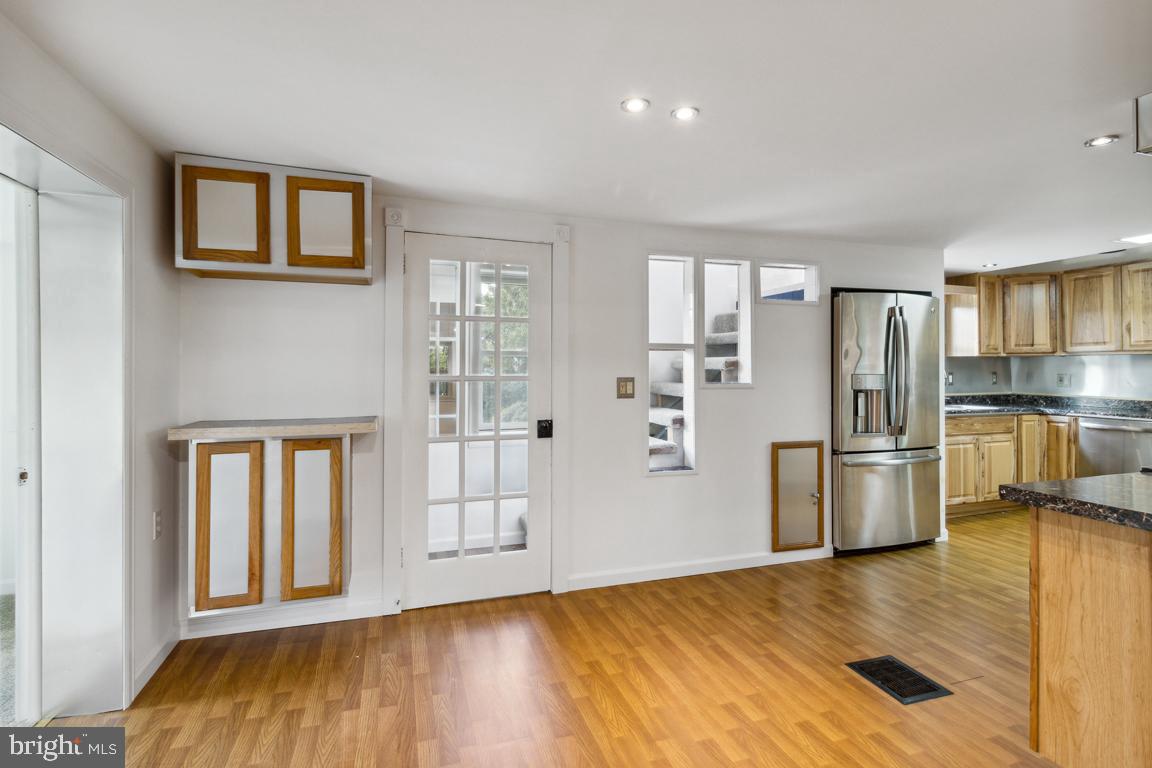 2300 Liberty Road Sykesville, MD 21784 - Photo 8 of 25 a kitchen with a refrigerator and a sink