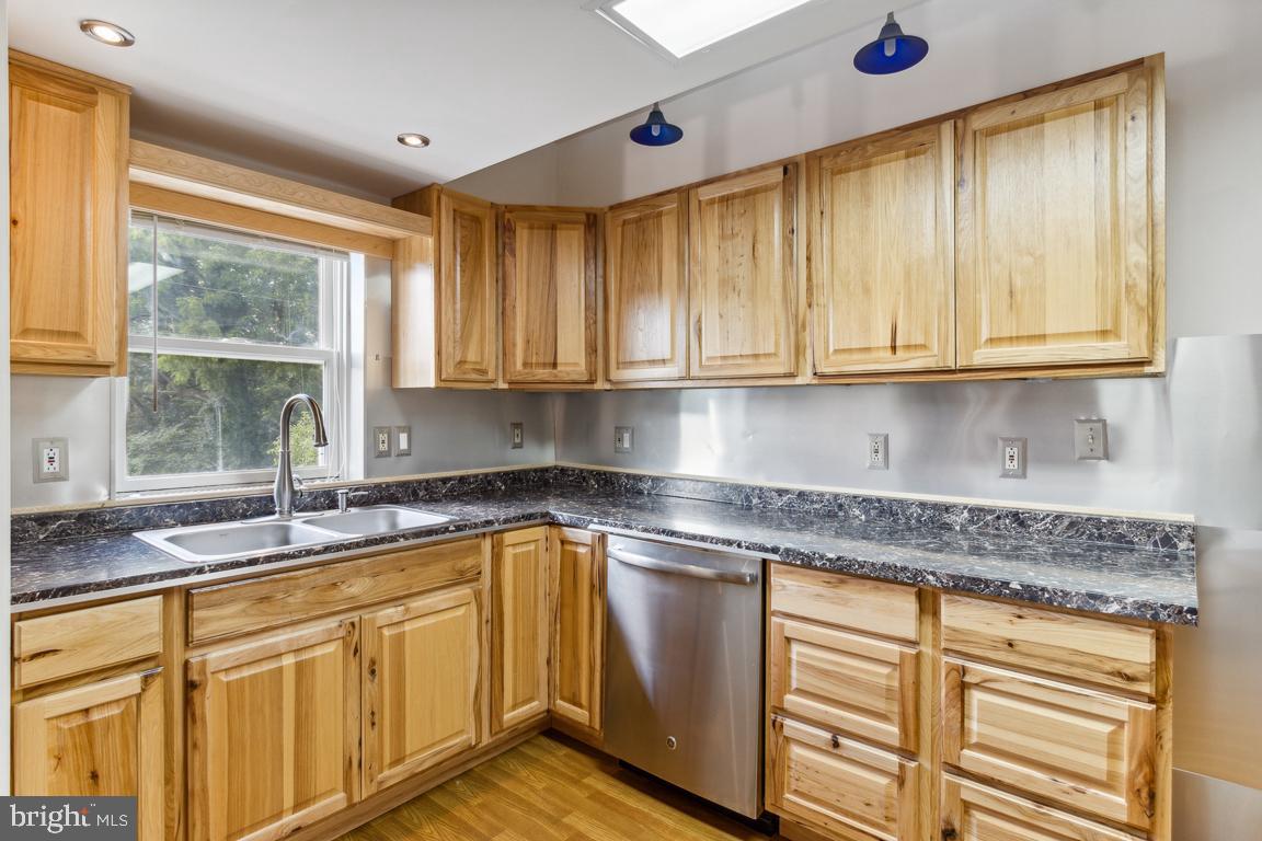 2300 Liberty Road Sykesville, MD 21784 - Photo 10 of 25 a kitchen with stainless steel appliances granite countertop a sink a stove and a microwave