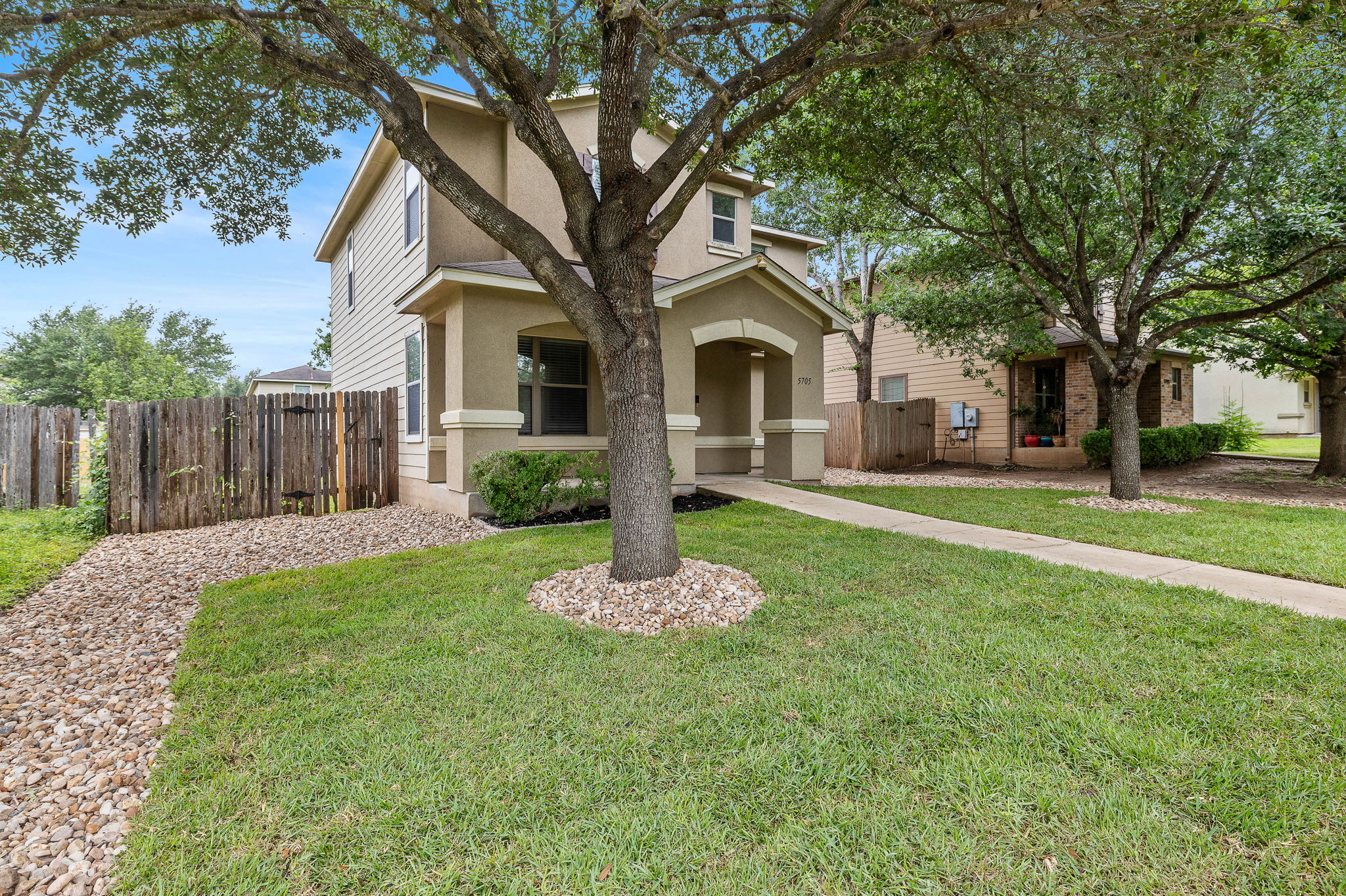 5705 Viewpoint Drive Austin, TX 78744 - Photo 2 of 30 Mature shade trees, fresh landscaping, and curb appeal that makes a great first impression.
