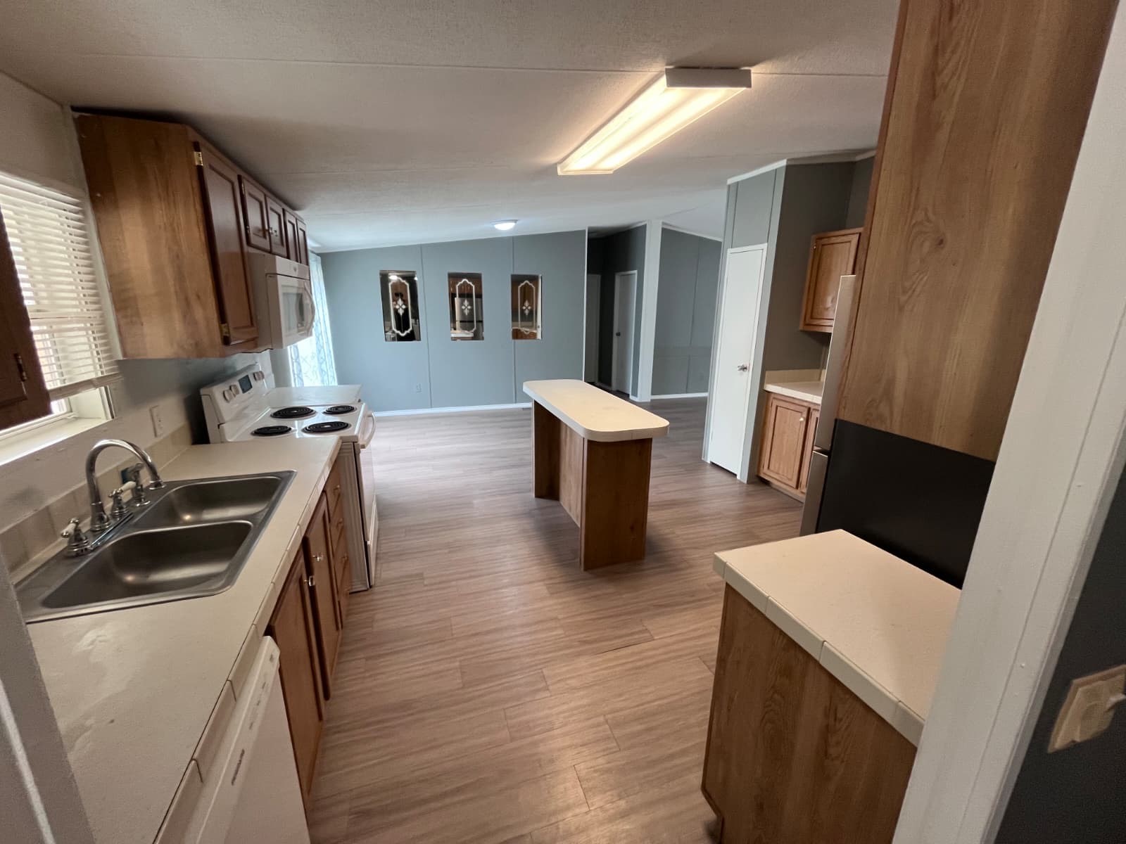 14912 Hannah Way Conroe, TX 77302 - Photo 14 of 20 a kitchen that has a sink and a stove