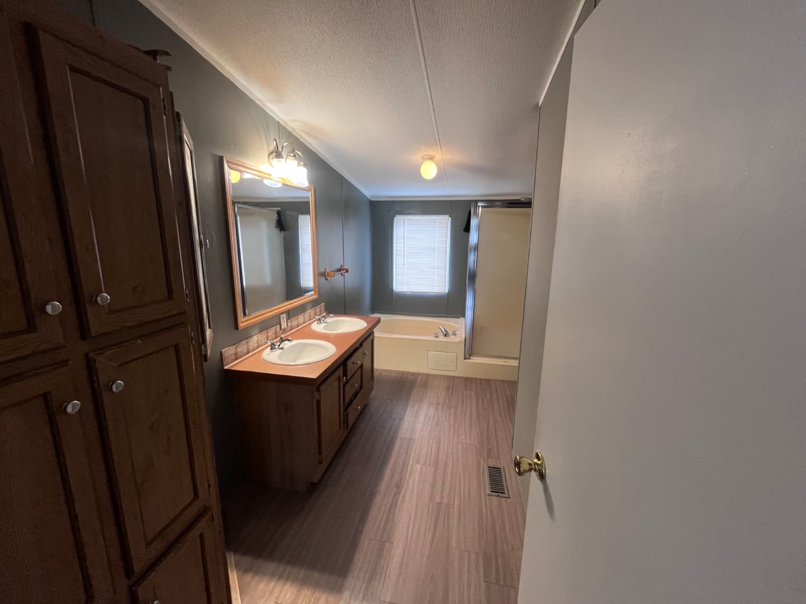 14912 Hannah Way Conroe, TX 77302 - Photo 17 of 20 a bathroom with a sink a mirror and a toilet