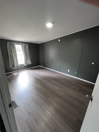 a bathroom with a sink a toilet a mirror and tub