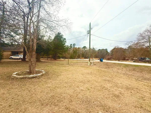 a backyard of a house with barbeque oven