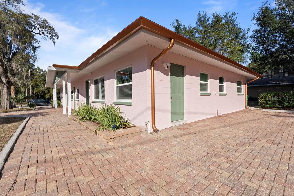 11987 Maple Street Dunnellon, FL 34432 - Photo 33 of 72 a front view of a house with garden