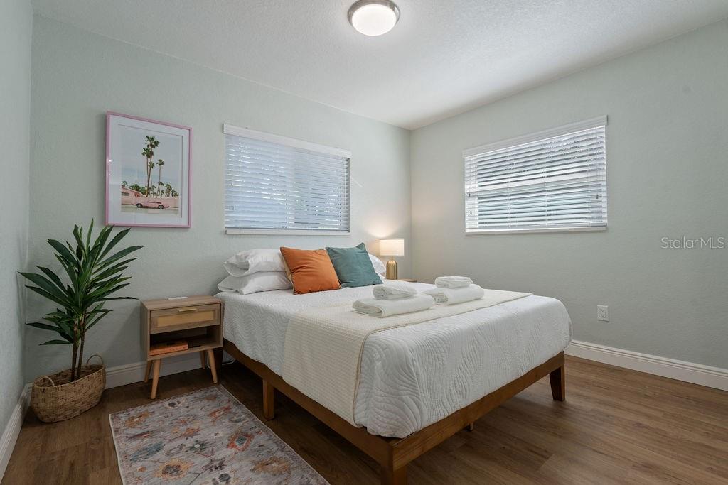 11987 Maple Street Dunnellon, FL 34432 - Photo 36 of 72 a bedroom with a bed table and a window