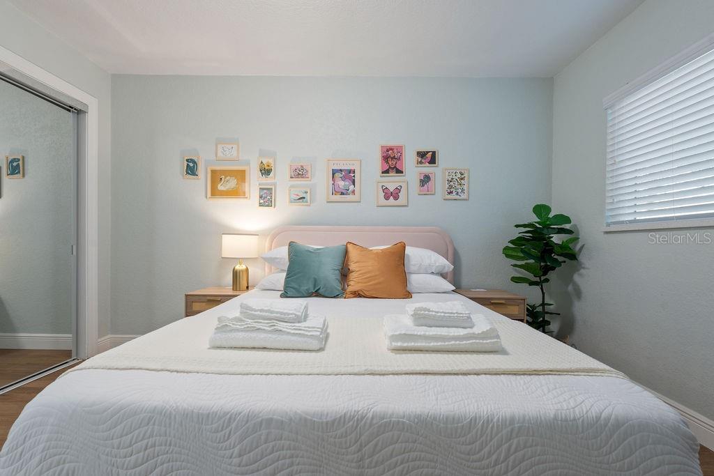 11987 Maple Street Dunnellon, FL 34432 - Photo 42 of 72 a bed sitting in a bedroom and painting on the wall