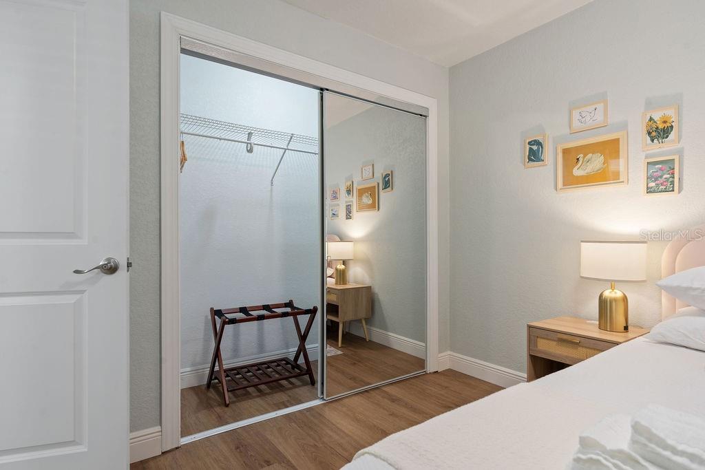 11987 Maple Street Dunnellon, FL 34432 - Photo 47 of 72 a bedroom with a bed and a table in it