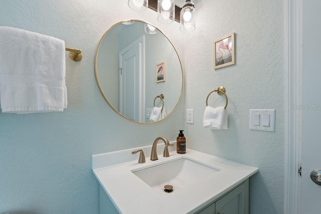 11987 Maple Street Dunnellon, FL 34432 - Photo 50 of 72 a bathroom with a sink and a mirror