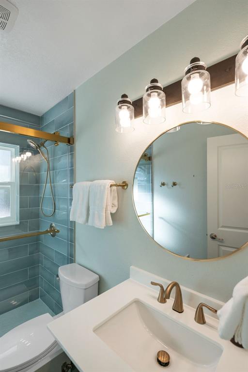 11987 Maple Street Dunnellon, FL 34432 - Photo 69 of 72 a bathroom with a sink and mirror