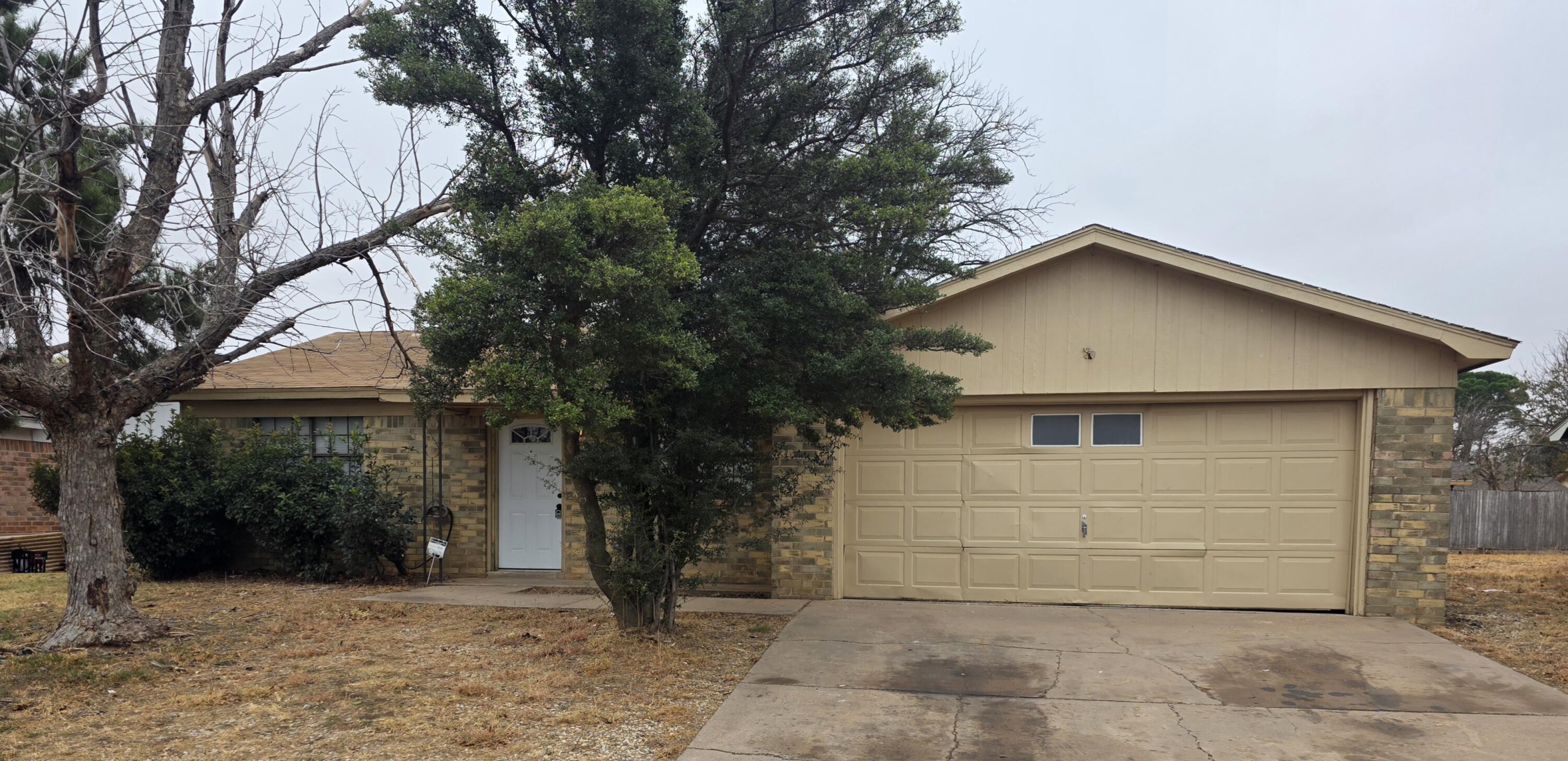 2307 78th Street Lubbock, TX 79423 - Photo 2 of 21 a view of a house with a yard
