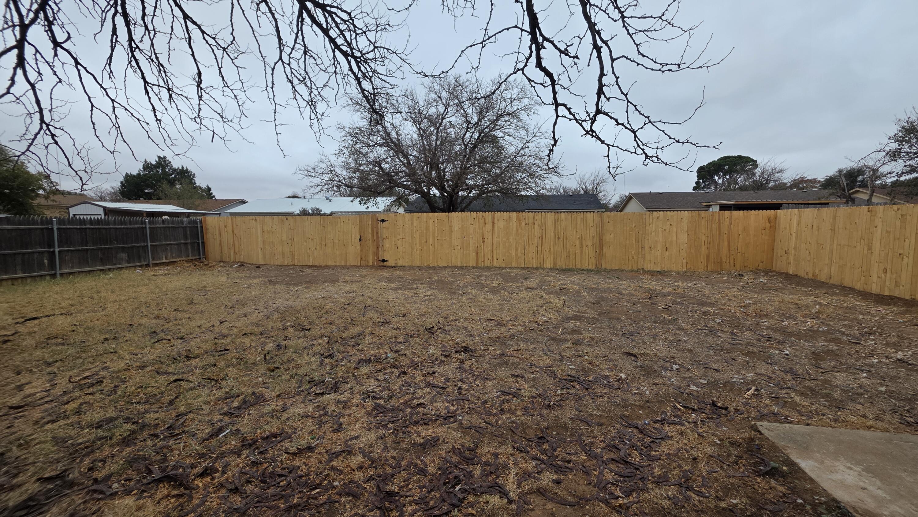 2307 78th Street Lubbock, TX 79423 - Photo 21 of 21 a view of backyard and trees