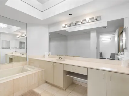 a bathroom with a sink double vanity and a mirror
