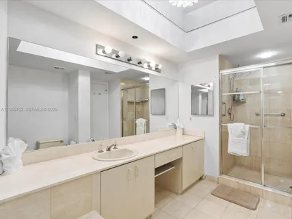 a bathroom with a sink double vanity and a mirror