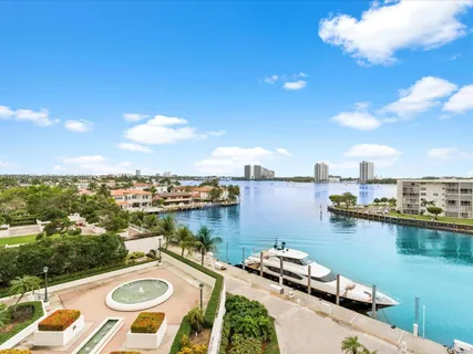 a view of a lake with couches and city view