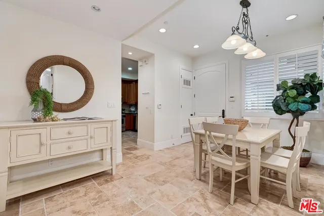 a kitchen with a table and chairs in it