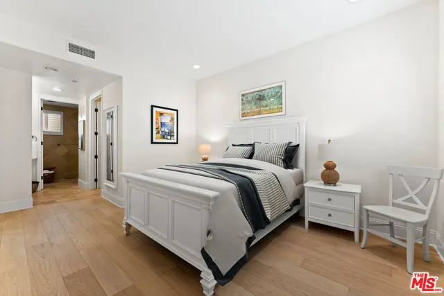 a bedroom with a bed and a cabinets