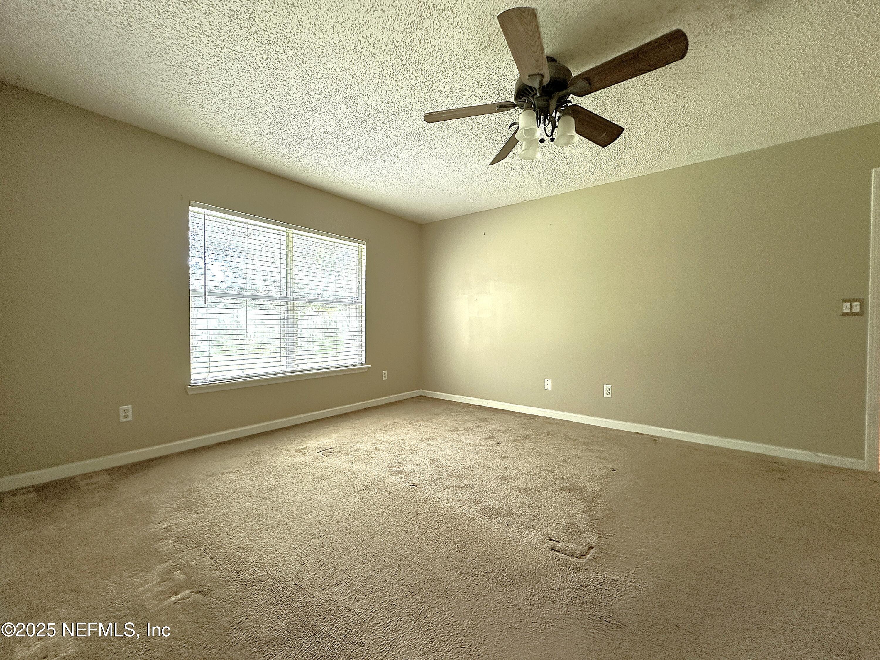 83041 St Mark Drive Yulee, FL 32097 - Photo 11 of 28 an empty room with a window
