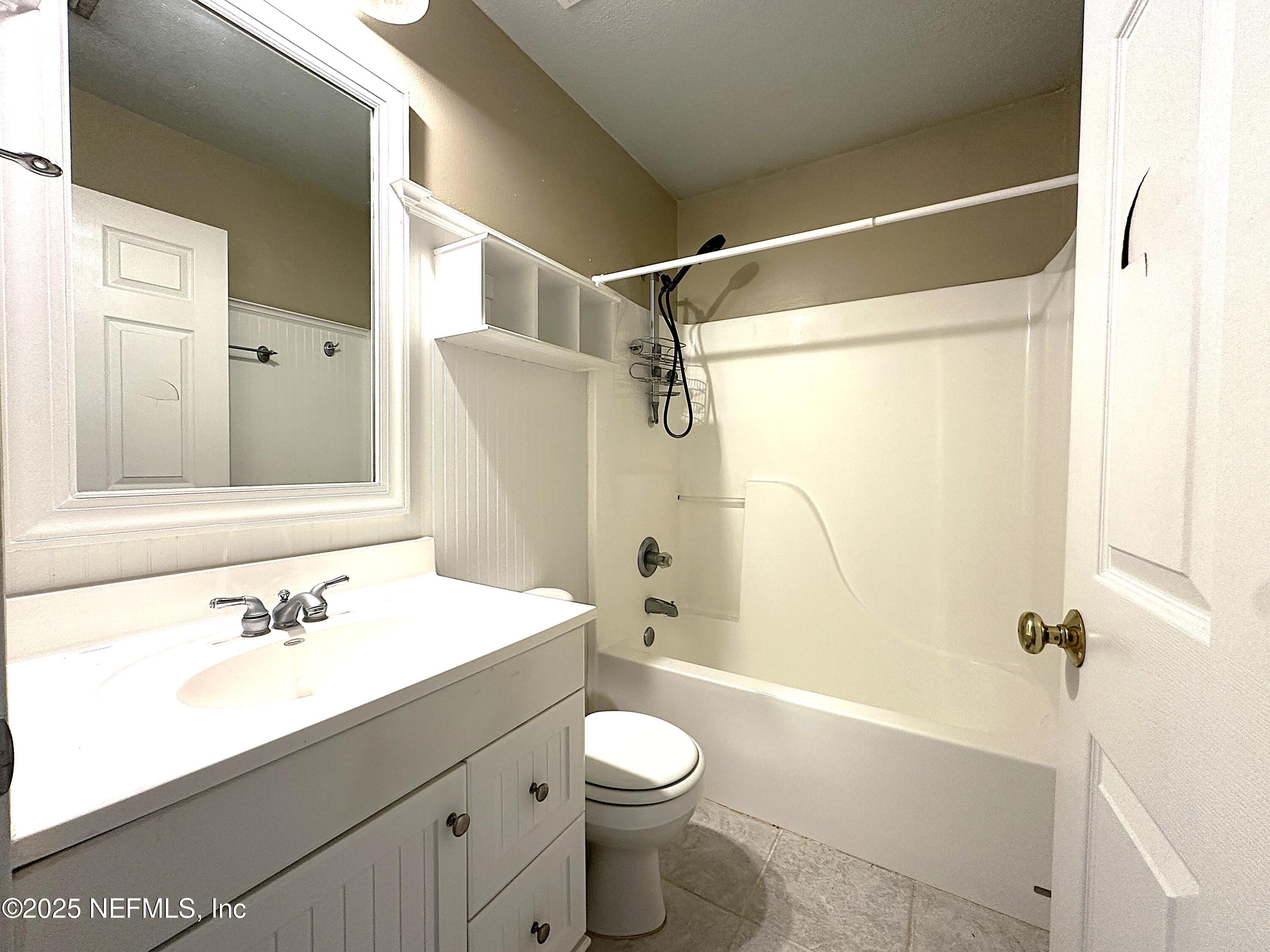 83041 St Mark Drive Yulee, FL 32097 - Photo 17 of 28 a bathroom with a sink a toilet and shower