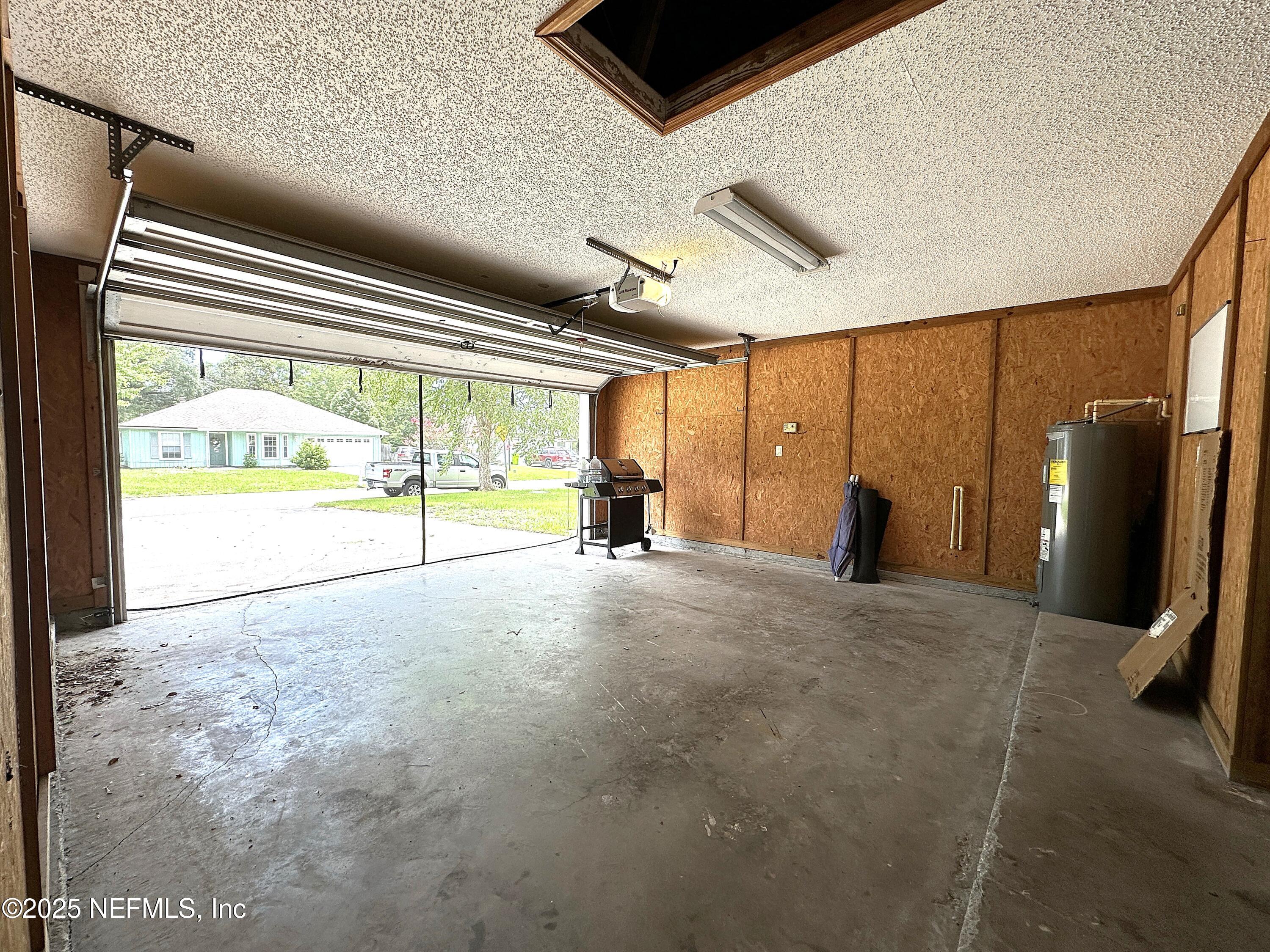83041 St Mark Drive Yulee, FL 32097 - Photo 19 of 28 a view of an empty room with a fireplace