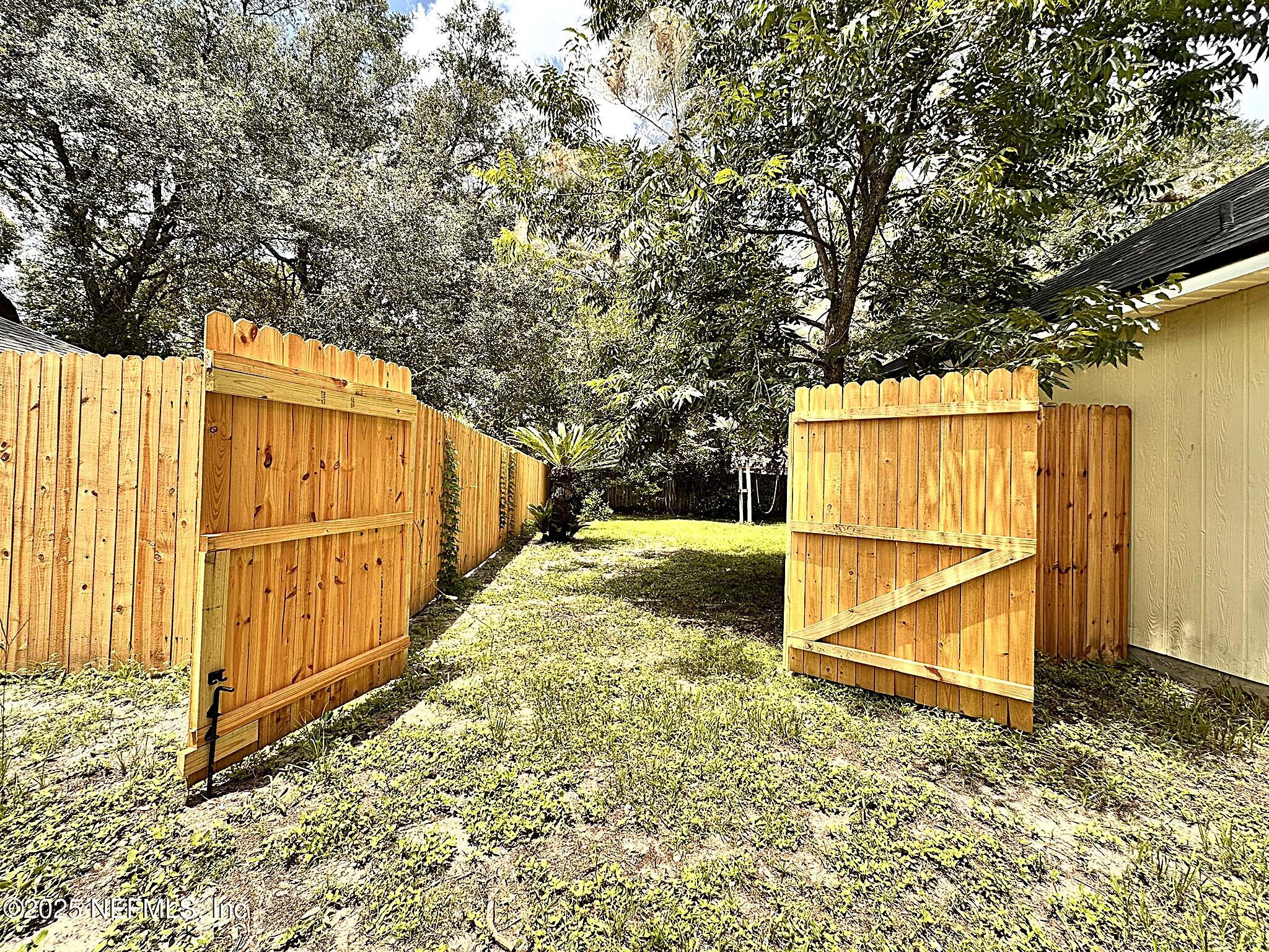 83041 St Mark Drive Yulee, FL 32097 - Photo 21 of 28 a view of small yard with large trees