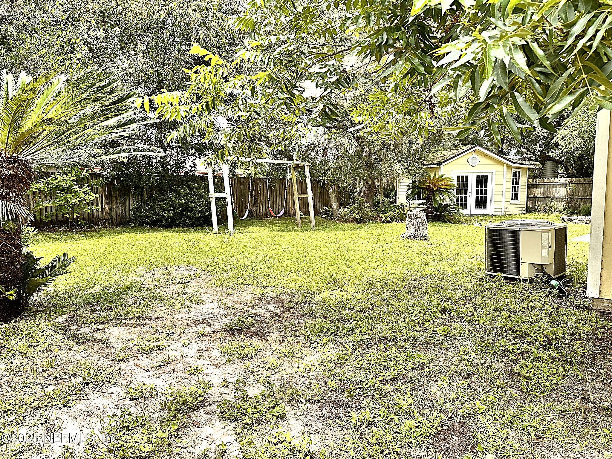 83041 St Mark Drive Yulee, FL 32097 - Photo 22 of 28 a front view of a house with a yard