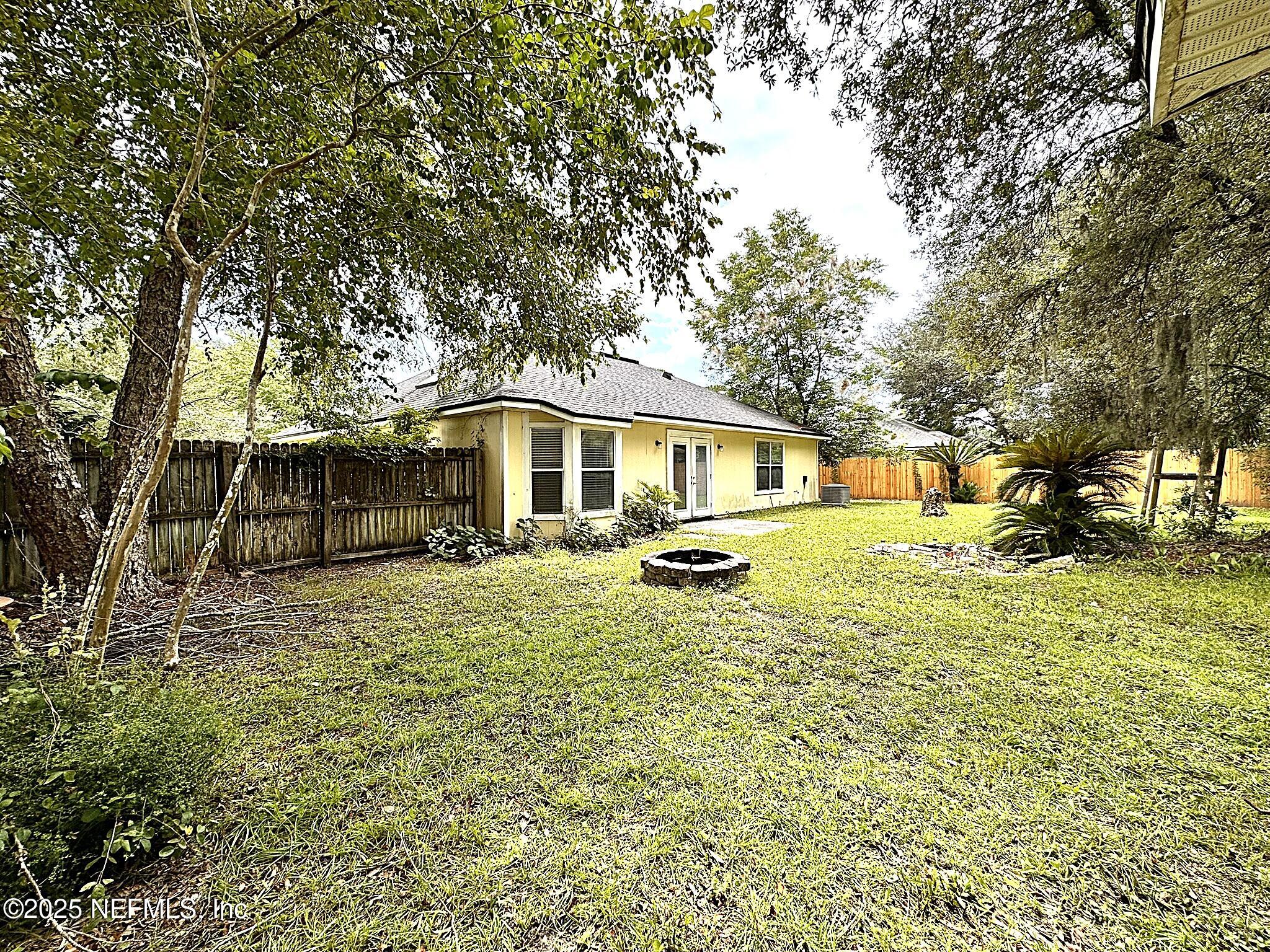 83041 St Mark Drive Yulee, FL 32097 - Photo 24 of 28 a front view of a house with a yard