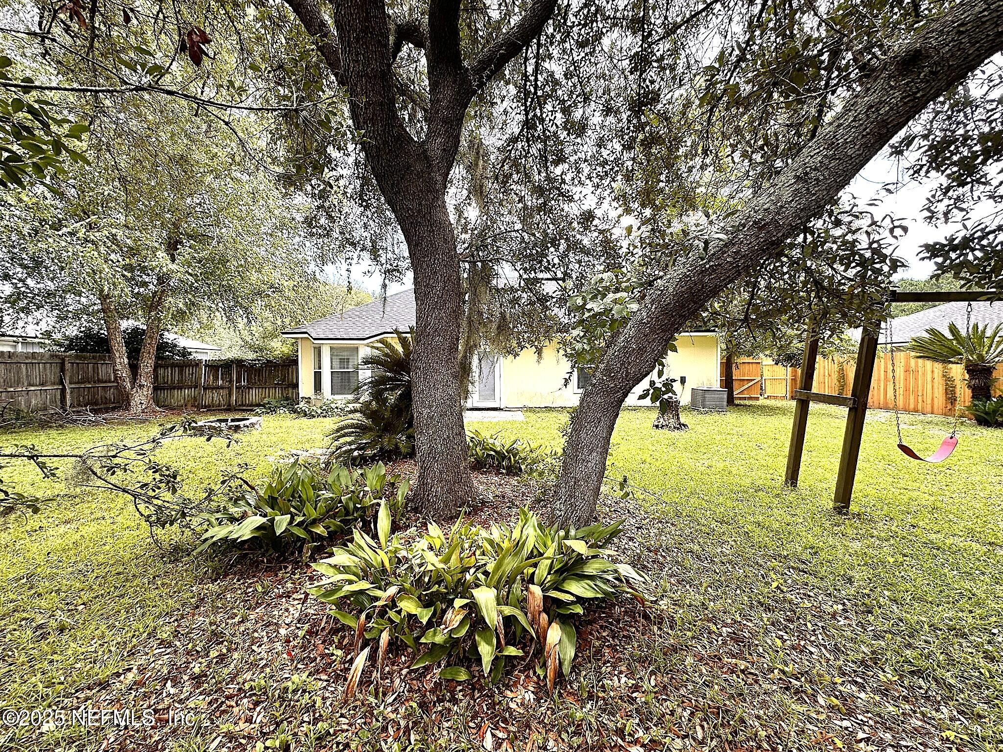 83041 St Mark Drive Yulee, FL 32097 - Photo 26 of 28 a view of backyard of the house