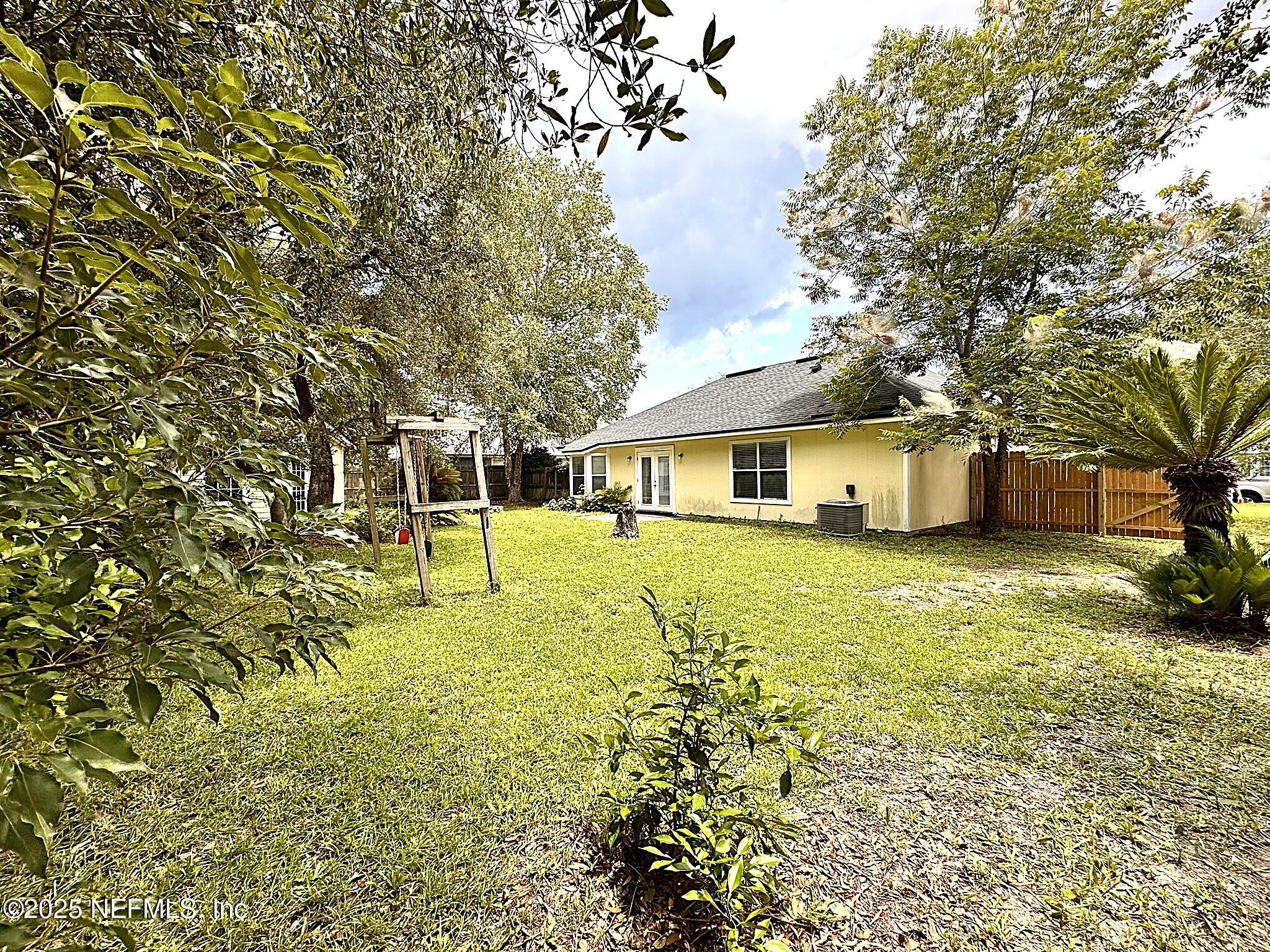 83041 St Mark Drive Yulee, FL 32097 - Photo 27 of 28 a front view of a house with a yard