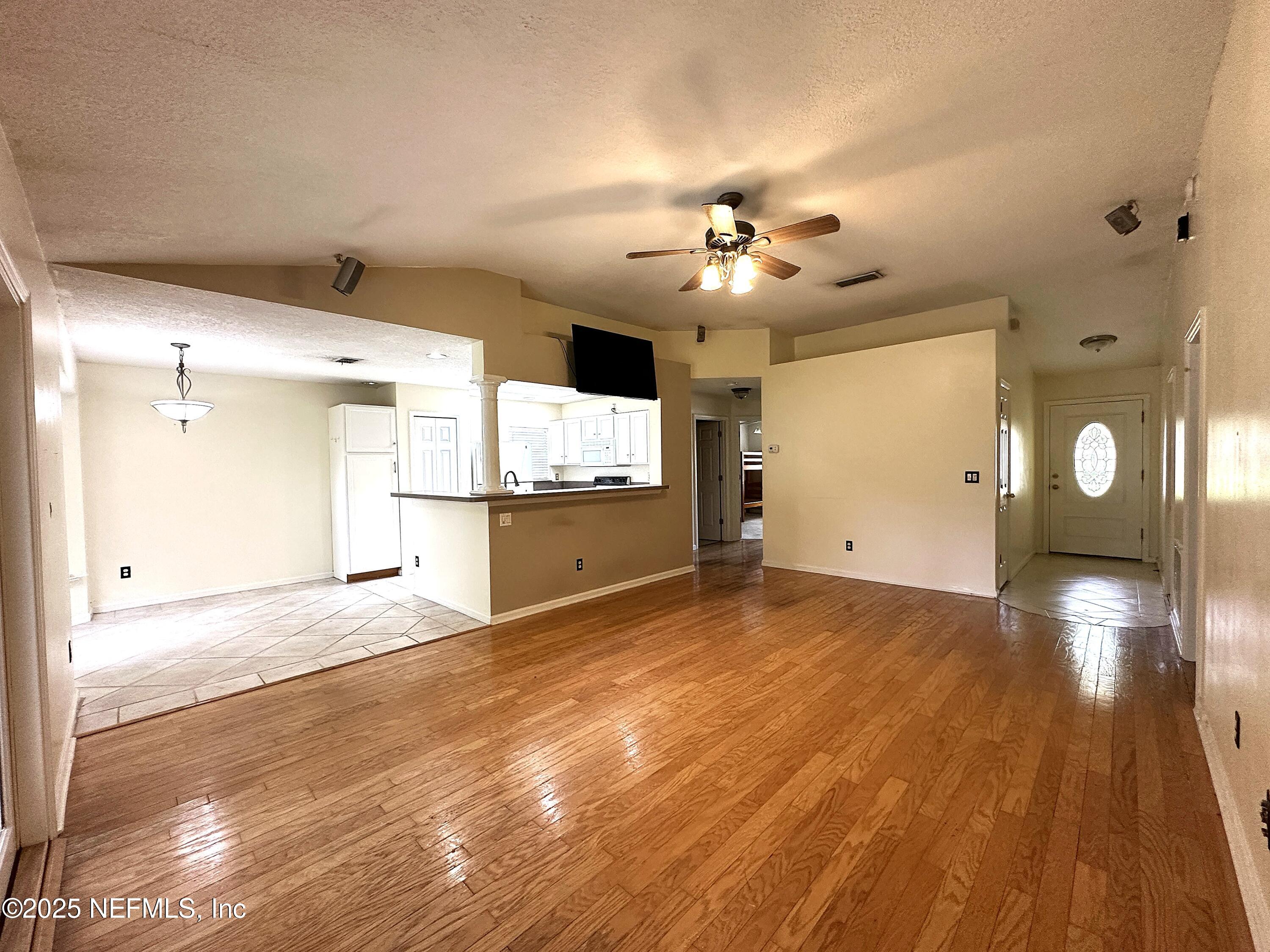 83041 St Mark Drive Yulee, FL 32097 - Photo 5 of 28 a view of a kitchen with a sink and a large mirror