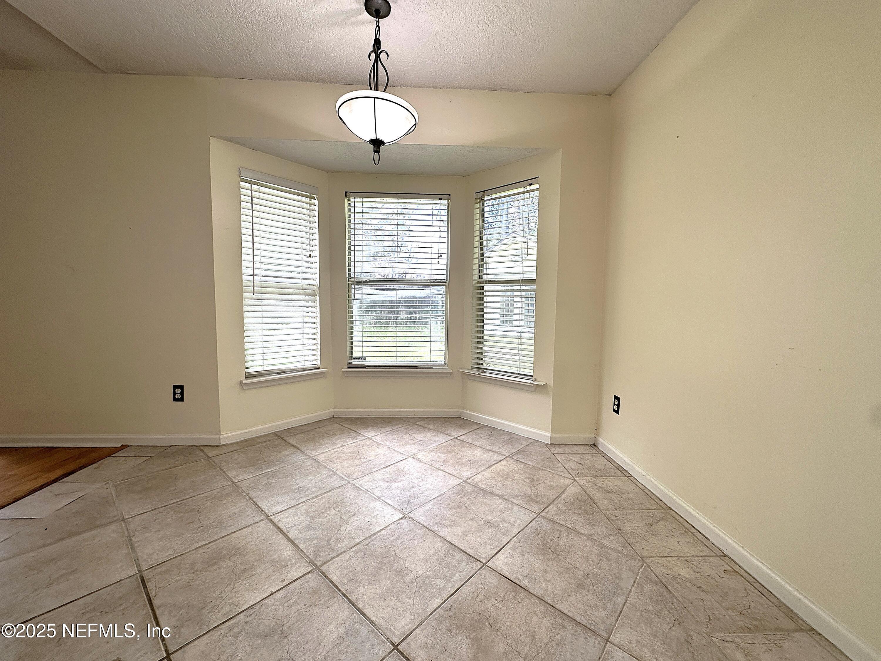 83041 St Mark Drive Yulee, FL 32097 - Photo 8 of 28 a view of an empty room with a window