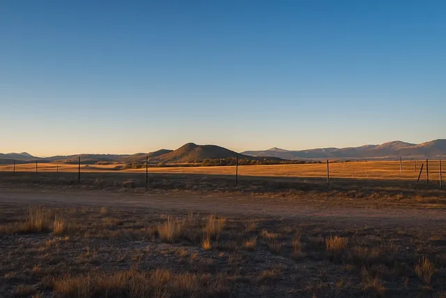 a view of an ocean and a mountain