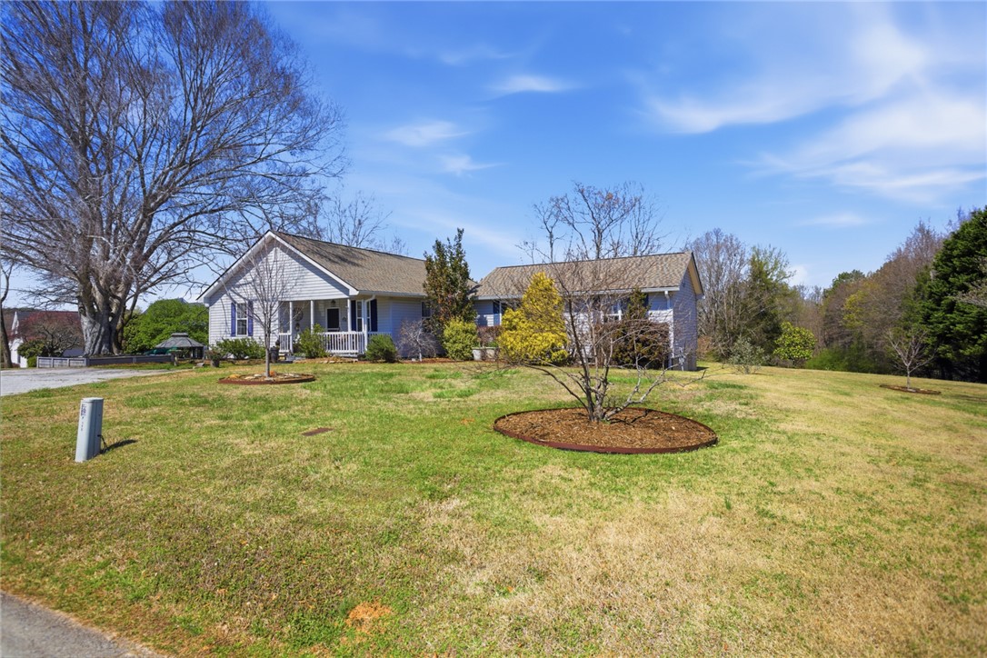 175 Burkett Road Seneca, SC 29672 - Photo 46 of 47 This charming home features a well-maintained lawn and an inviting front porch.