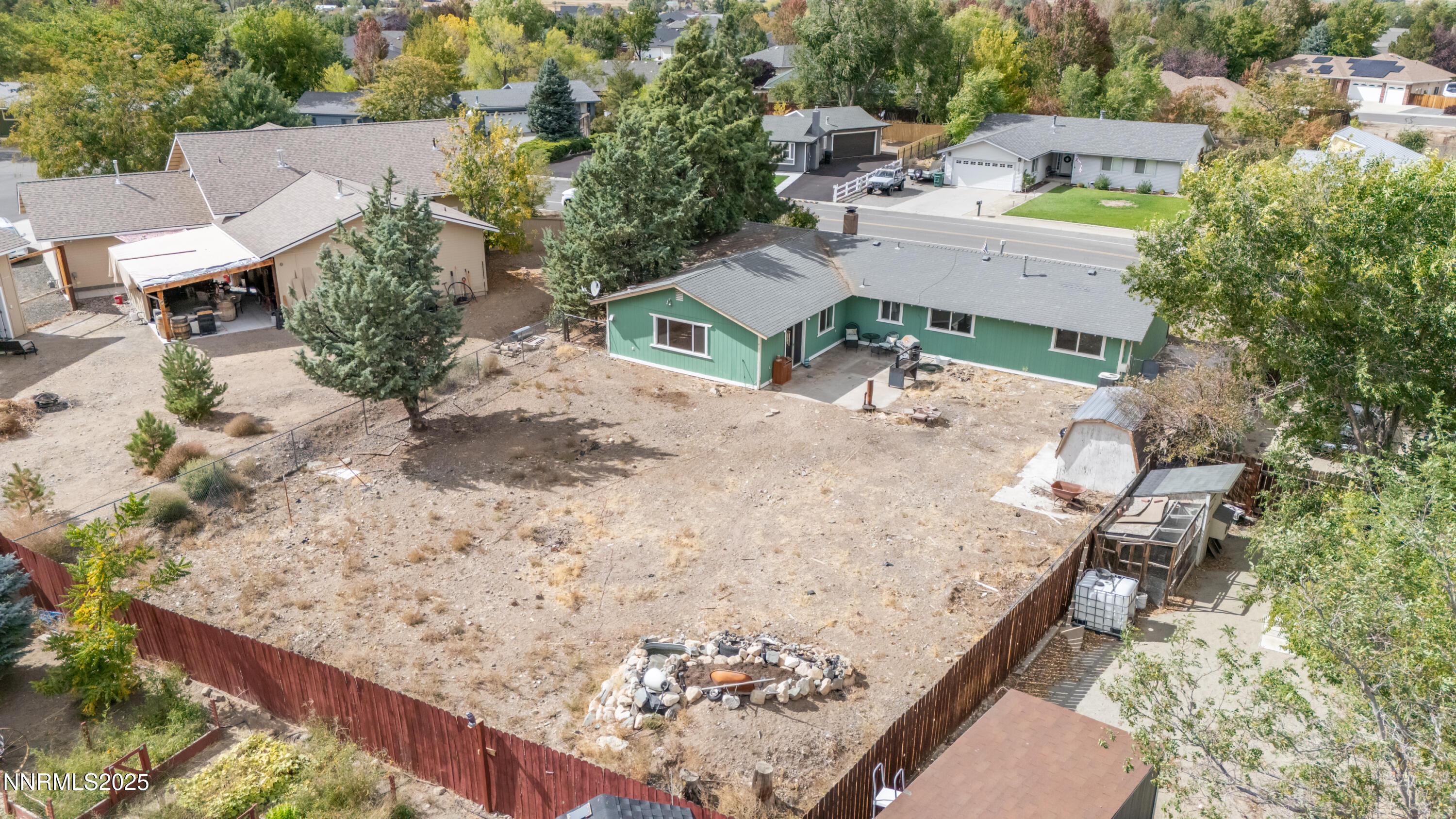 1193 Manhattan Way Gardnerville, NV 89460 - Photo 37 of 49 an aerial view of a house with a yard and wooden fence