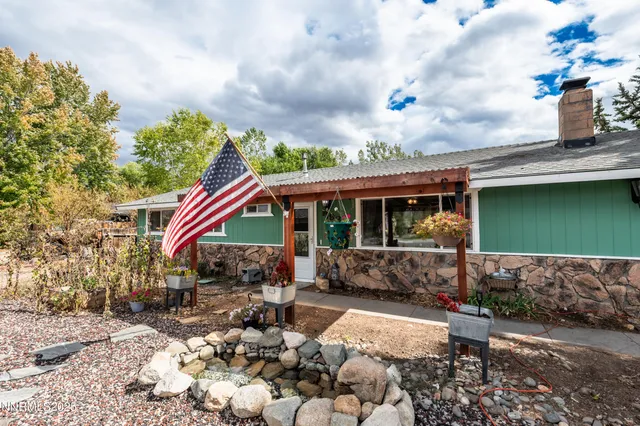 a view of house with outdoor space and sitting space