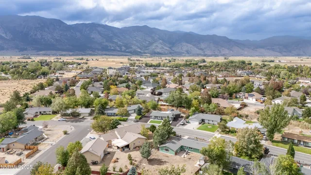 a view of a big room with wooden floor and a bathroom