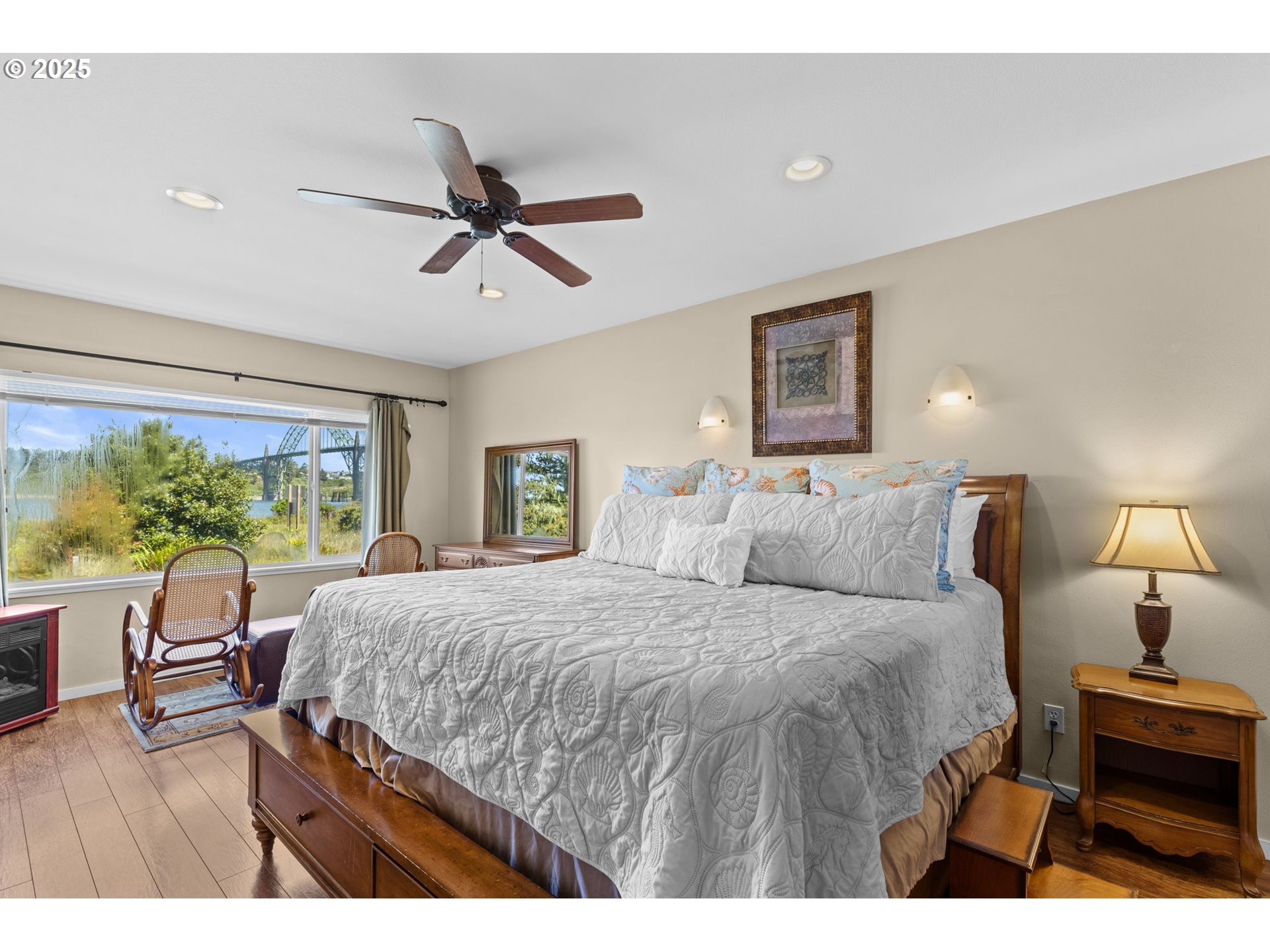238 Southwest 27th Street Newport, OR 97366 - Photo 21 of 34 a bedroom with a bed a table and chair with the large mirror