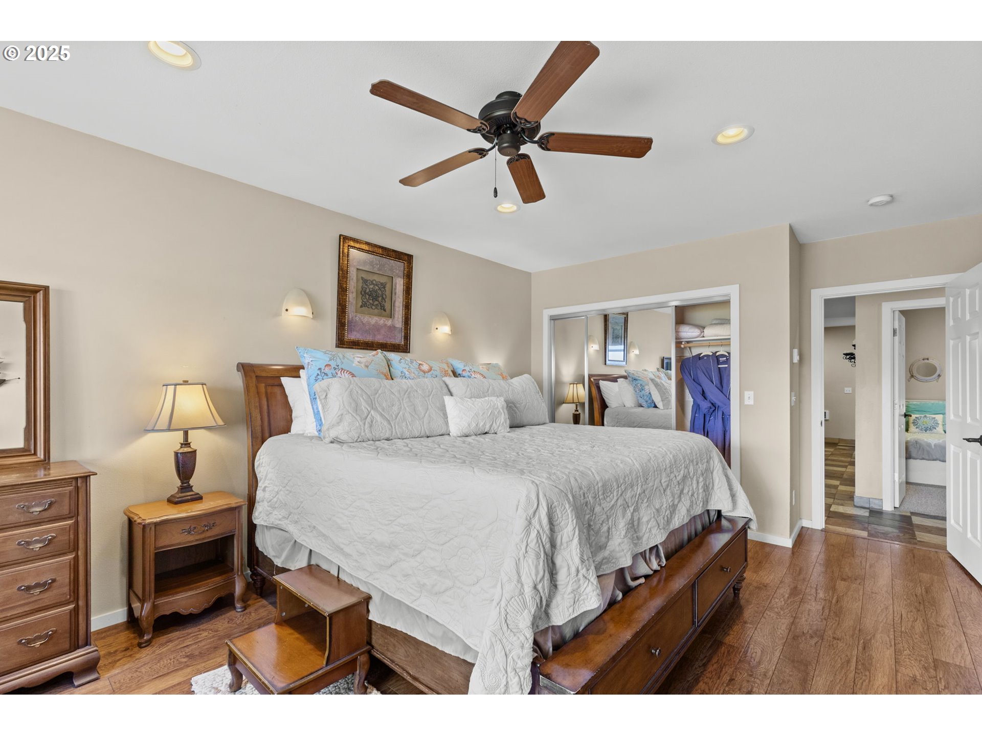 238 Southwest 27th Street Newport, OR 97366 - Photo 22 of 34 a bed room with a bed and a ceiling fan