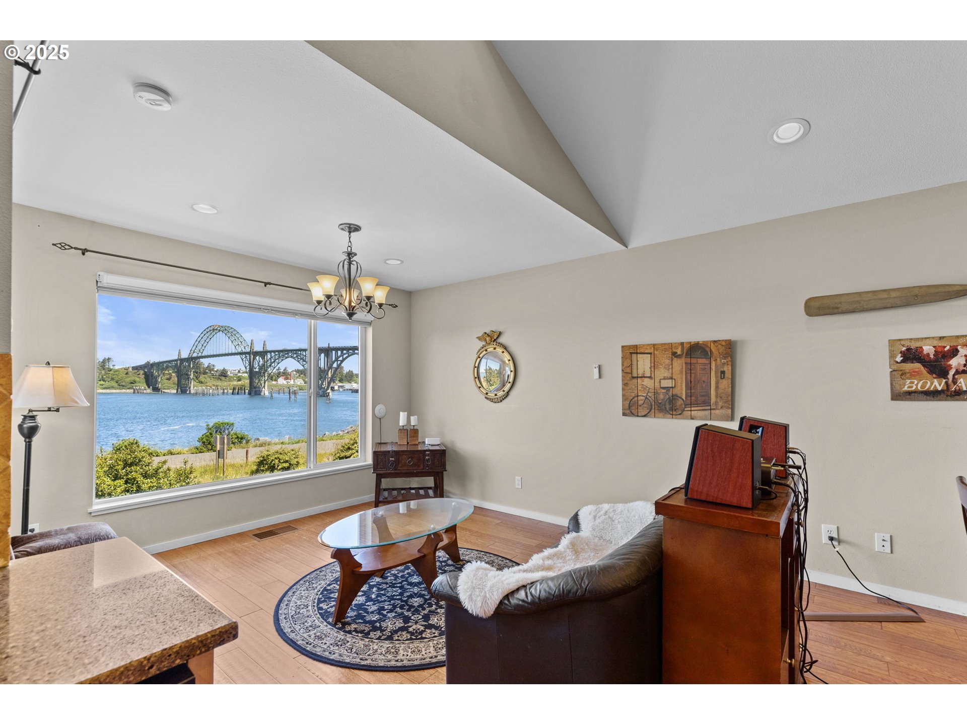 238 Southwest 27th Street Newport, OR 97366 - Photo 4 of 34 a living room with furniture and a floor to ceiling window